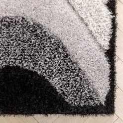 Logan Lowry Abstract Waves Shag Black Ivory 7 ft. 5 in. x 9 ft. 10 in. 3D Textured Area Rug by Well Woven 14 Logan Lowry Abstract Waves Shag Black Ivory 7 ft. 5 in. x 9 ft. 10 in. 3D Textured Area Rug by Well Woven -Linon Home Decor Sales black ivory well woven area rugs log 83 7 1f 1000