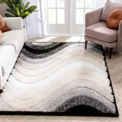Logan Lowry Abstract Waves Shag Black Ivory 7 ft. 5 in. x 9 ft. 10 in. 3D Textured Area Rug by Well Woven 12 Logan Lowry Abstract Waves Shag Black Ivory 7 ft. 5 in. x 9 ft. 10 in. 3D Textured Area Rug by Well Woven -Linon Home Decor Sales black ivory well woven area rugs log 83 7 c3 1000