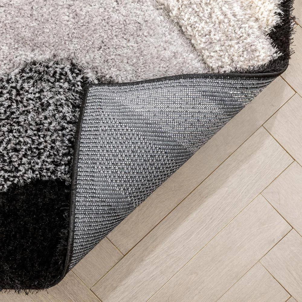 Logan Lowry Abstract Waves Shag Black Ivory 7 ft. 5 in. x 9 ft. 10 in. 3D Textured Area Rug by Well Woven 9 Logan Lowry Abstract Waves Shag Black Ivory 7 ft. 5 in. x 9 ft. 10 in. 3D Textured Area Rug by Well Woven - Image 7