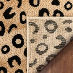 Dulcet Leopard Black 2 ft. x 7 ft. Modern Animal Print Runner Rug by Well Woven -Linon Home Decor Sales black well woven area rugs 19532 fa 1000