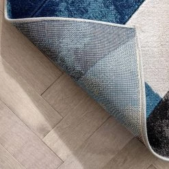 Good Vibes Rosa Blue Modern Geometric Triangles 3 ft. 11 in. x 5 ft. 3 in. High-Low Area Rug by Well Woven -Linon Home Decor Sales blue well woven area rugs gv 104 4 1f 1000