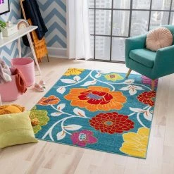 StarBright Daisy Flowers Blue 5 ft. x 7 ft. Kids Area Rug by Well Woven -Linon Home Decor Sales blue well woven kids rugs 09265 c3 1000