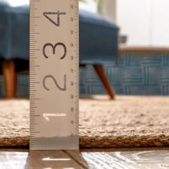 Romy Laylani Farmhouse Solid Pattern Natural 5 ft. x 7 ft. 6 in. Hand-Braided Chunky-Textured Jute Area Rug by Well Woven -Linon Home Decor Sales natural well woven area rugs rom 32 5 1f 1000