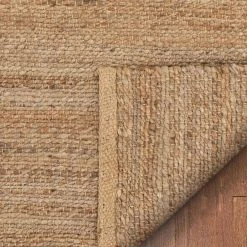 Romy Laylani Farmhouse Solid Pattern Natural 5 ft. x 7 ft. 6 in. Hand-Braided Chunky-Textured Jute Area Rug by Well Woven -Linon Home Decor Sales natural well woven area rugs rom 32 5 44 1000