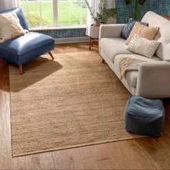 Romy Laylani Farmhouse Solid Pattern Natural 5 ft. x 7 ft. 6 in. Hand-Braided Chunky-Textured Jute Area Rug by Well Woven -Linon Home Decor Sales natural well woven area rugs rom 32 5 c3 1000
