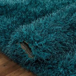 Kuki Chie Glam Solid Textured Ultra-Soft Teal 7 ft. 10 in. x 9 ft. 10 in. 2-Tone Shag Area Rug by Well Woven 16 Kuki Chie Glam Solid Textured Ultra-Soft Teal 7 ft. 10 in. x 9 ft. 10 in. 2-Tone Shag Area Rug by Well Woven -Linon Home Decor Sales teal well woven area rugs ku 18 7 1f 1000