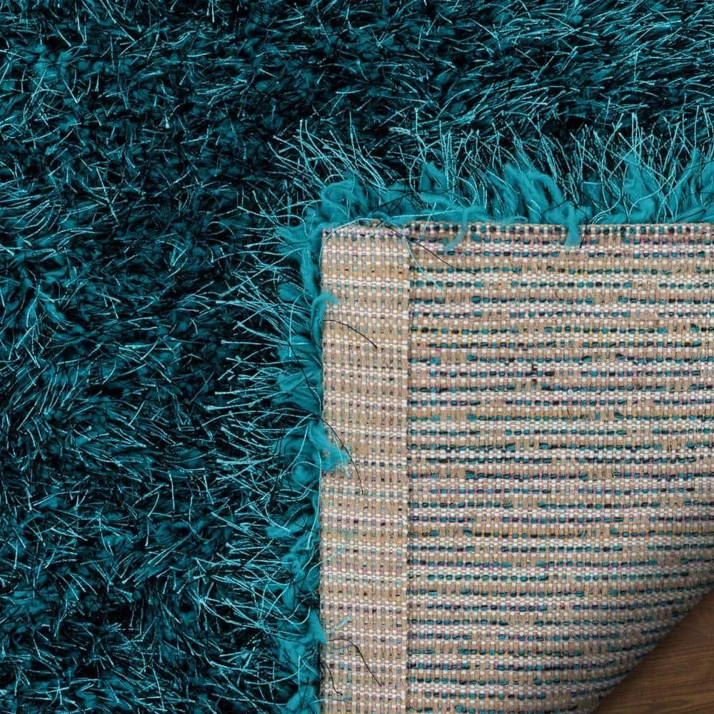 Kuki Chie Glam Solid Textured Ultra-Soft Teal 7 ft. 10 in. x 9 ft. 10 in. 2-Tone Shag Area Rug by Well Woven 9 Kuki Chie Glam Solid Textured Ultra-Soft Teal 7 ft. 10 in. x 9 ft. 10 in. 2-Tone Shag Area Rug by Well Woven - Image 7
