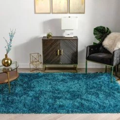 Kuki Chie Glam Solid Textured Ultra-Soft Teal 7 ft. 10 in. x 9 ft. 10 in. 2-Tone Shag Area Rug by Well Woven 13 Kuki Chie Glam Solid Textured Ultra-Soft Teal 7 ft. 10 in. x 9 ft. 10 in. 2-Tone Shag Area Rug by Well Woven -Linon Home Decor Sales teal well woven area rugs ku 18 7 66 1000