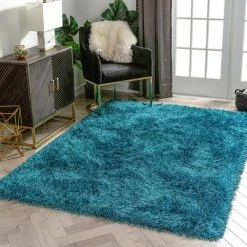 Kuki Chie Glam Solid Textured Ultra-Soft Teal 7 ft. 10 in. x 9 ft. 10 in. 2-Tone Shag Area Rug by Well Woven 14 Kuki Chie Glam Solid Textured Ultra-Soft Teal 7 ft. 10 in. x 9 ft. 10 in. 2-Tone Shag Area Rug by Well Woven -Linon Home Decor Sales teal well woven area rugs ku 18 7 c3 1000