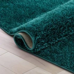 Rainbow Chroma Glam Solid Teal 5 ft. 3 in. x 7 ft. 3 in. Multi-Textured Shimmer Pile Shag Area Rug by Well Woven -Linon Home Decor Sales teal well woven area rugs ra 16 5 76 1000